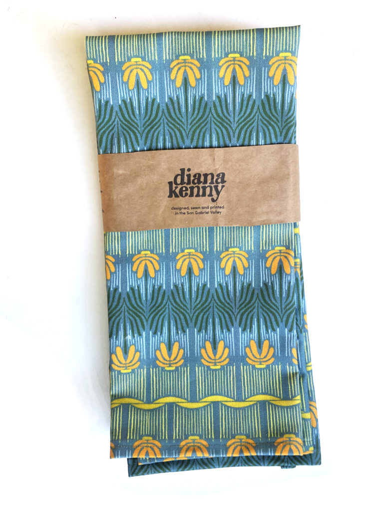 California made Art Nouveau kitchen towels with orange daisy in the sunlight theme